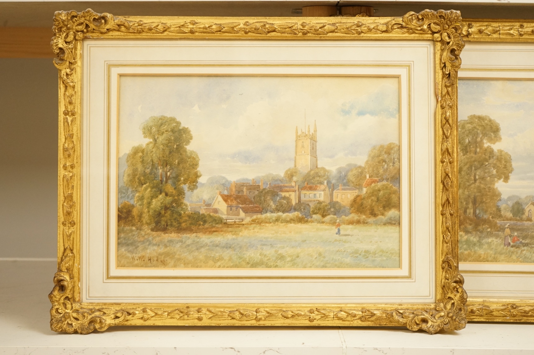 William Woods Hodges (19th. C), Landscapes with churches, signed, pair of watercolours, 19 x 30cm, gilt framed